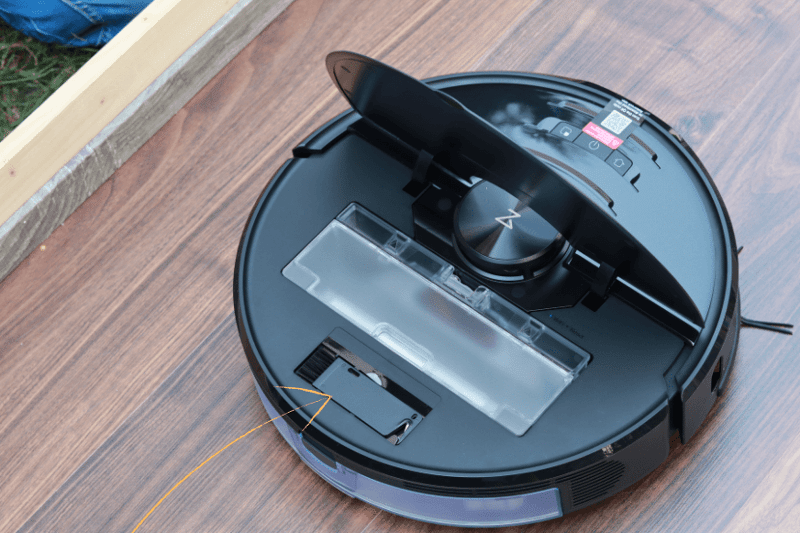 Roborock S6 MaxV stands on the floor with an open lid